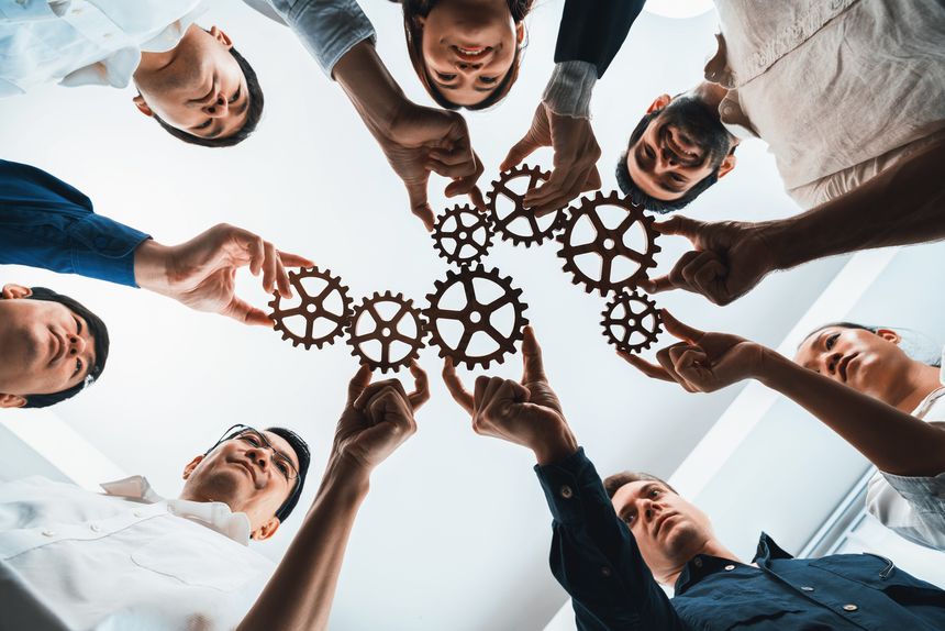 Business team joining cogwheel in circular together symbolize successful group of business partnership and strong collective unity teamwork in community workplace with productive efficiency. Prudent