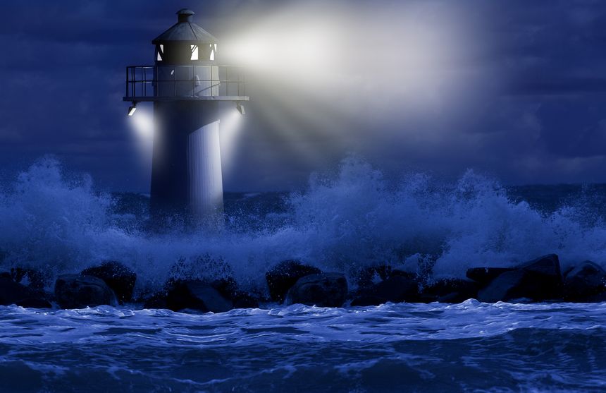 In the dark, the little lighthouse rises upright from the turbulent sea. For centuries, lighthouses have guided seafarers past deadly reefs and cliffs in lashing storms.