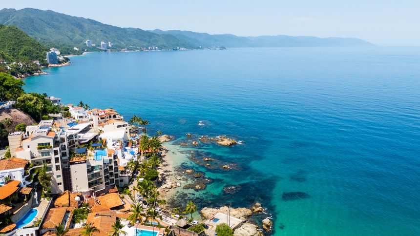 Aerial view of amapas beach with luxury villas and rocky coastline in puerto vallarta jalisco mexico