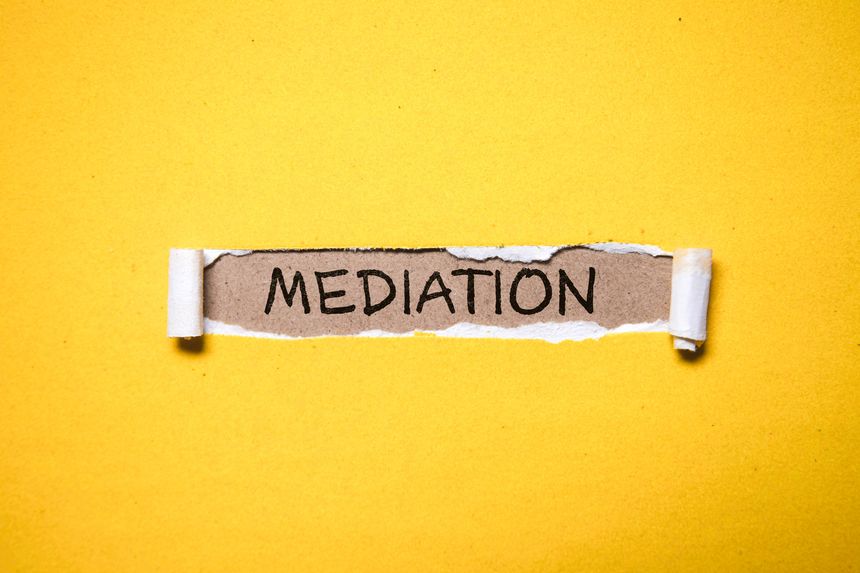 Mediation written under torn paper.