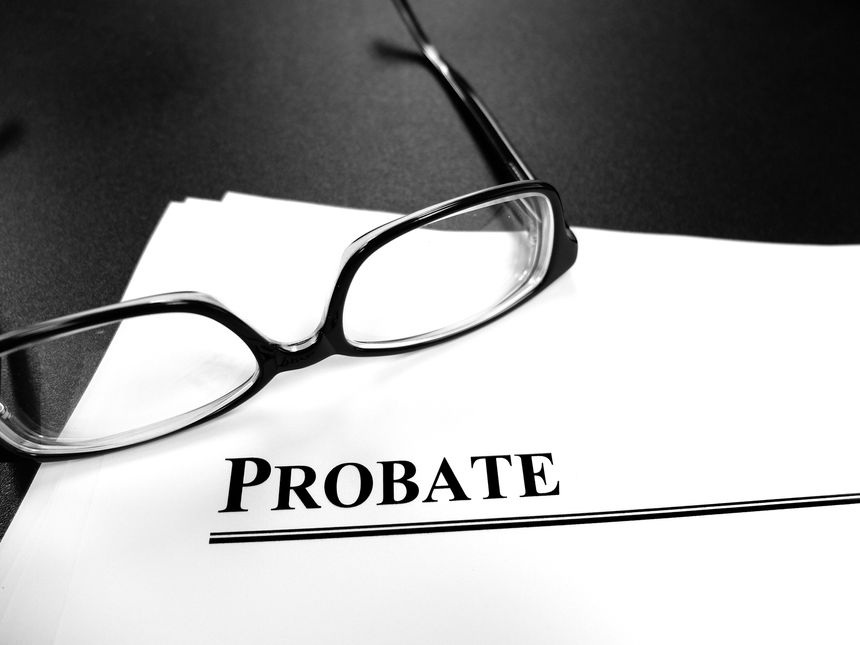Probate last will and testament Estate Planning documents on desk with glasses