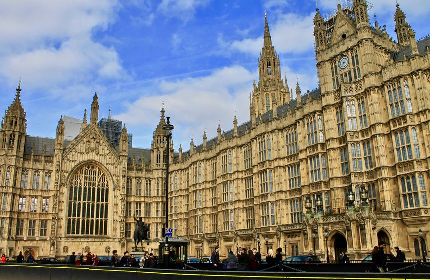 London, England - March 22, 2018: The Palace of Westminster, located within the city of London right on the banks of the River Thames, is the meeting place of the House of Commons and the House of Lords, the two houses that make up the Parliament of the United Kingdom. The palace was originally built in the year 1016 before a fire in 1834 demolished the building. It was then rebuilt between the years 1840 t 1876.