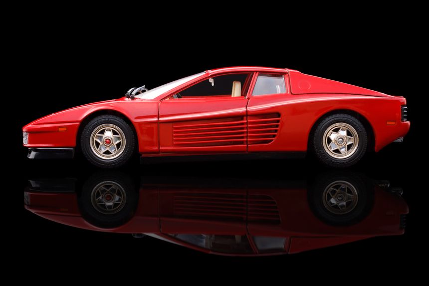 Krivoy Rog, Ukraine - April 21, 2014: Toy ferrari testarossa 1984 on black backgrond. The photo is made in a studio. Editorial Use Only.