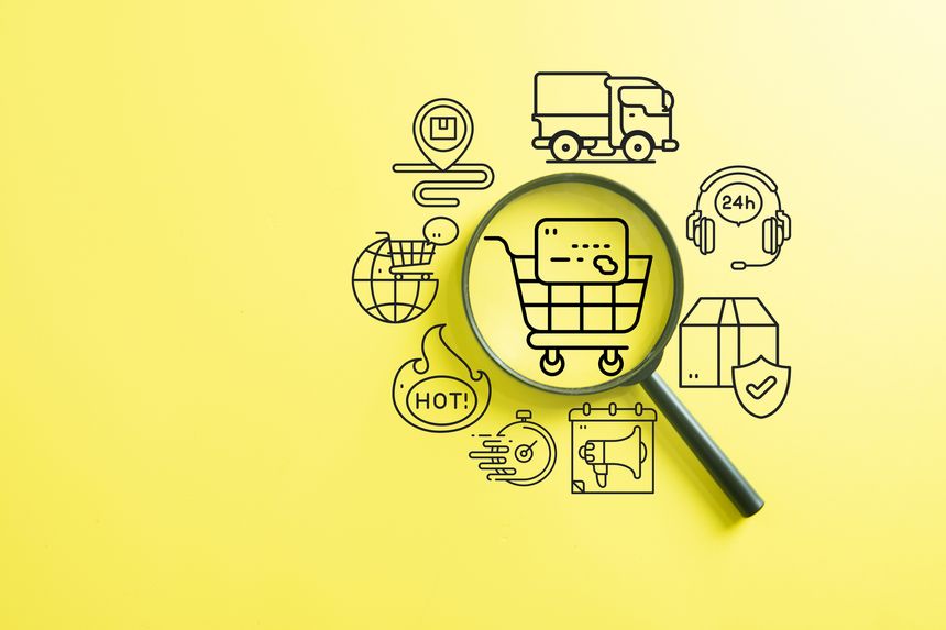 E-commerce and online shopping concept. Magnifying glass zooming on cart and credit card icon. Symbol of digital market, fast delivery, and logistics service on yellow background.,copyspace.