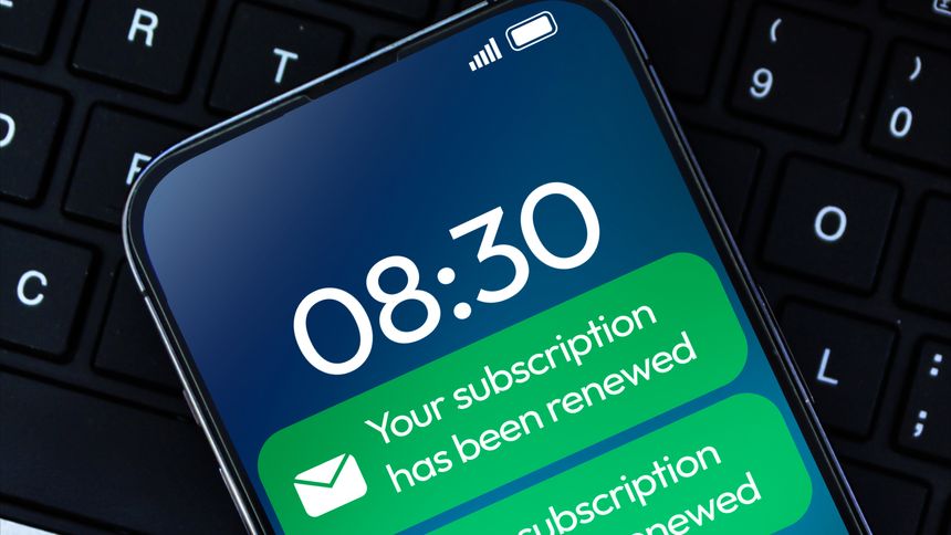Subscription Renewal message notification in green color on the smartphone screen close up background