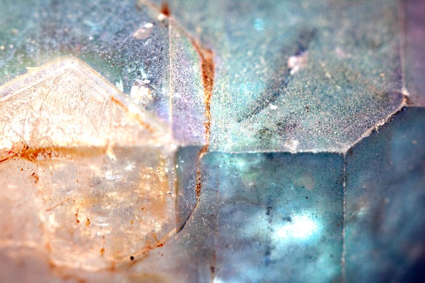 Beautiful close up of quartz crystal rock shard with reflective rainbow spiritual light