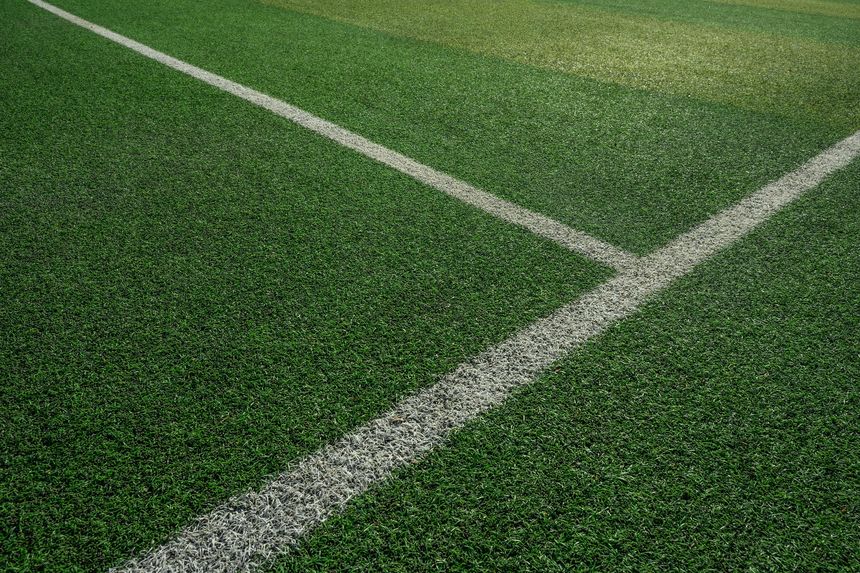 a soccer pitch with grass and white lines
