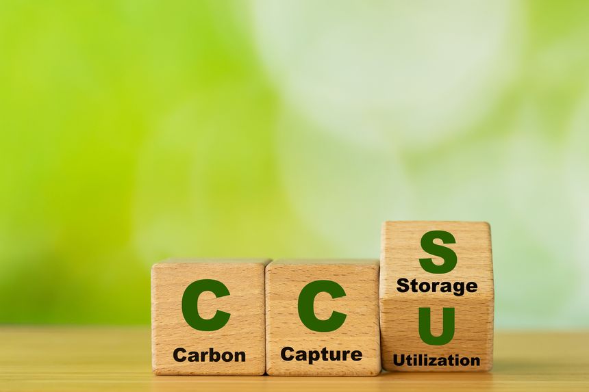 Wooden cubes form the symbol CCU (carbon capture utilization) and CCS (carbon capture storage). Environmental Business concept, Net zero action, Save energy, green energy, reduce carbon footprint