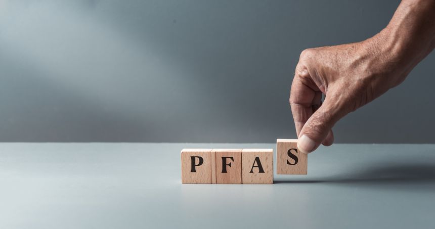 wooden blacks with pfas, per- and polyfluoroalkyl substances , concept of eternal or forever chemicals and pollution ,copy space .