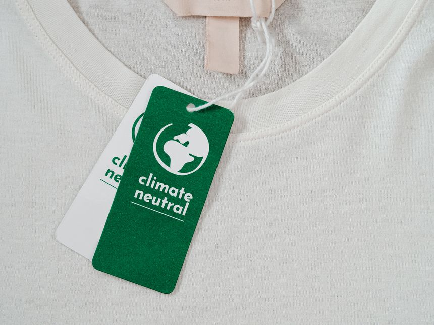 Carbon neutral t-shirt, Label Climate neutral on new clothes. Carbon neutral label concept in apparel, fashion industry. Ethical consumption.Increasing awareness for customers - carbon footpint