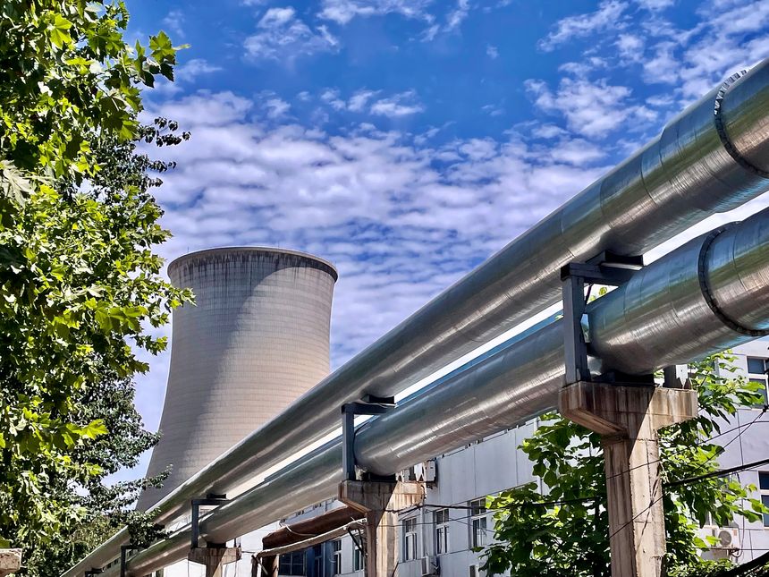 Shijiazhuang, Hebei Province, China- June 18, 2021:  Located downtown Shijiazhuang, a coal-fired thermoelectric power plant reactor and water pipes.