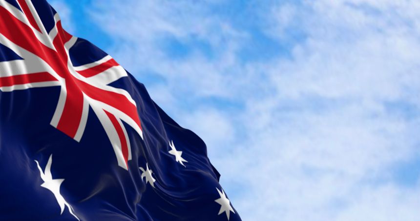 Australia national flag waving in the wind. Blue flag with Union Jack, white 5-pointed star symbolizing Southern Cross. 3d illustration render. Rippled fabric. Selective focus