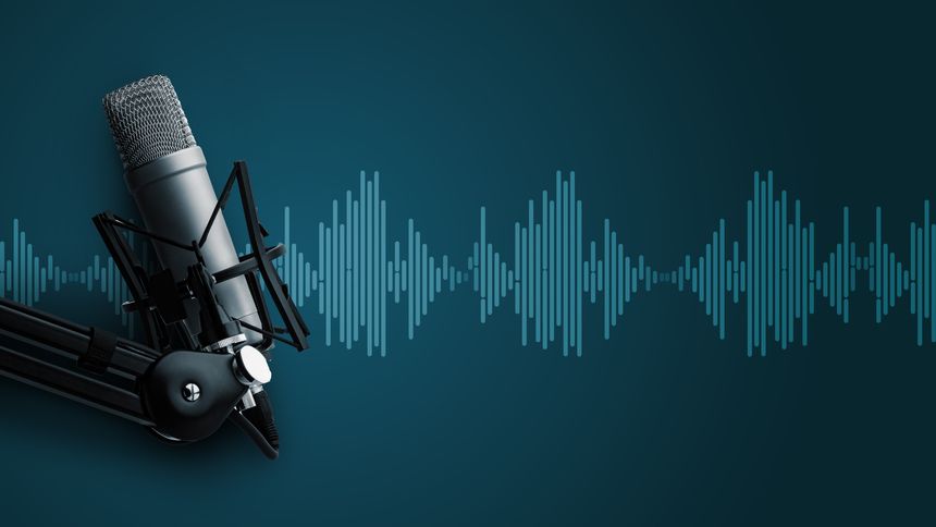 A microphone is set up for a podcast, showing sound wave patterns on a blue background.