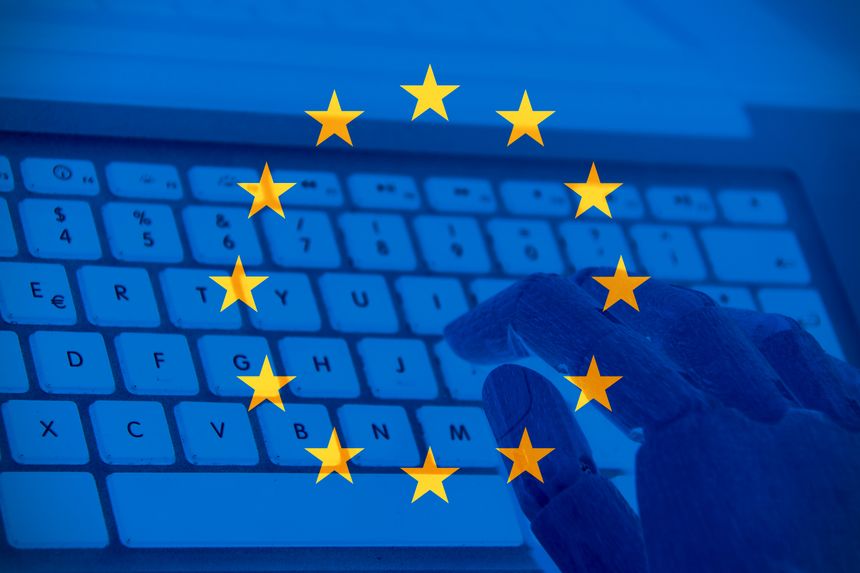 European union flag with a robot hand typing on a keyboard. Concept of Ai in Europe.