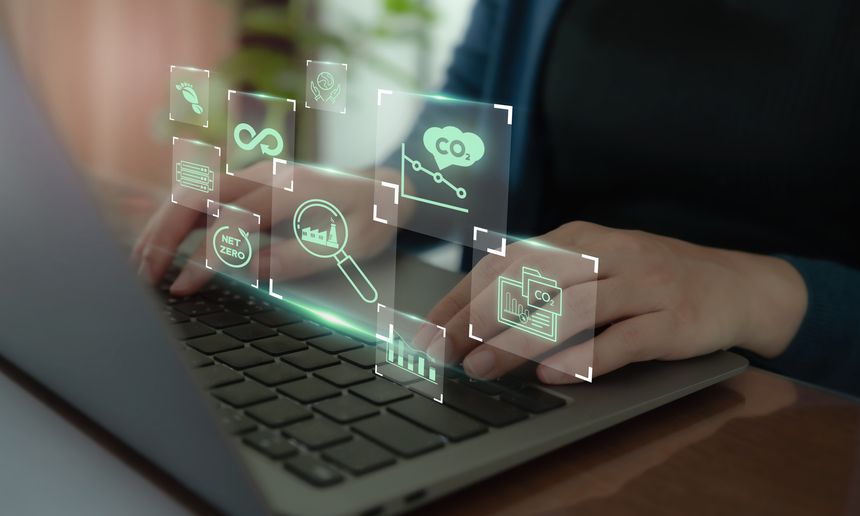 MRV System for Carbon Emissions Monitoring Concept. Using a laptop with digital icons representing digital tools used in Measurement, Reporting and Verification (MRV) for environmental monitoring.