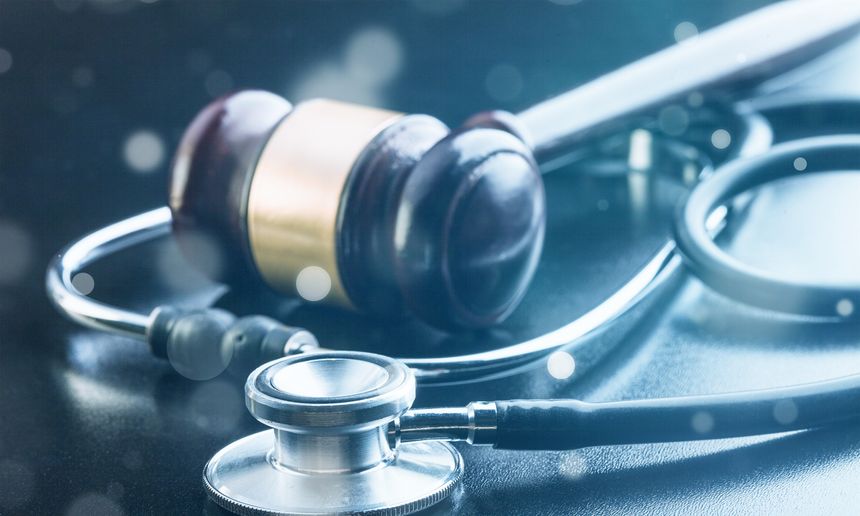 Judge gavel and stethoscope , close-up view