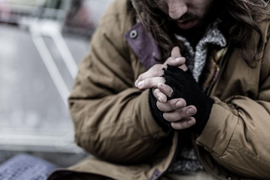 Close-up of dirty hands of beggar. Problems of homeless person in the city concept