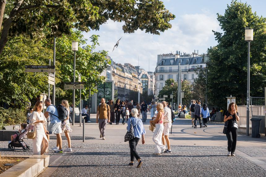 Paris, France - June 23 2025: Photo from the Allée André-Breton street in daylight with people walking, in the 1th arrondissement, center of Paris