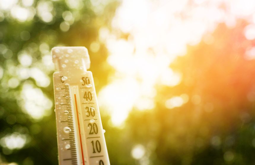 Thermometer for measuring outdoor air temperature. Tropical rain. Meteorological device for observing and measuring the weather. Weather forecast. Heavy rain in hot weather, drought in summer.