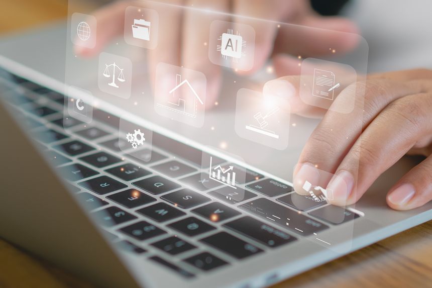 Concept digital technology in business law, real estate, and auction. professional uses laptop with holographic icons of AI, analytics, legal documents, symbolizing innovation and online solutions.