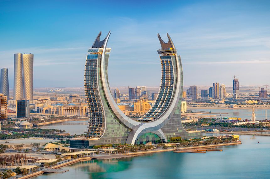Lusail, Qatar - December 20, 2024: Katara buildings view from Lusail Marina Park. Crescent Tower