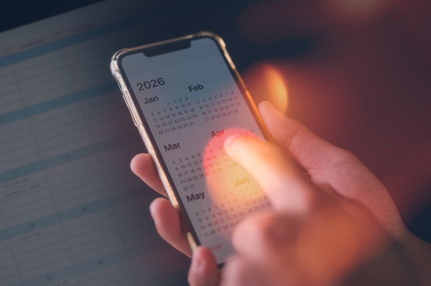 Concept of time management financial planning and reminder for 2026. man using smartphone working with calendar 2026, business planning marketing and investment, schedule appointment meeting