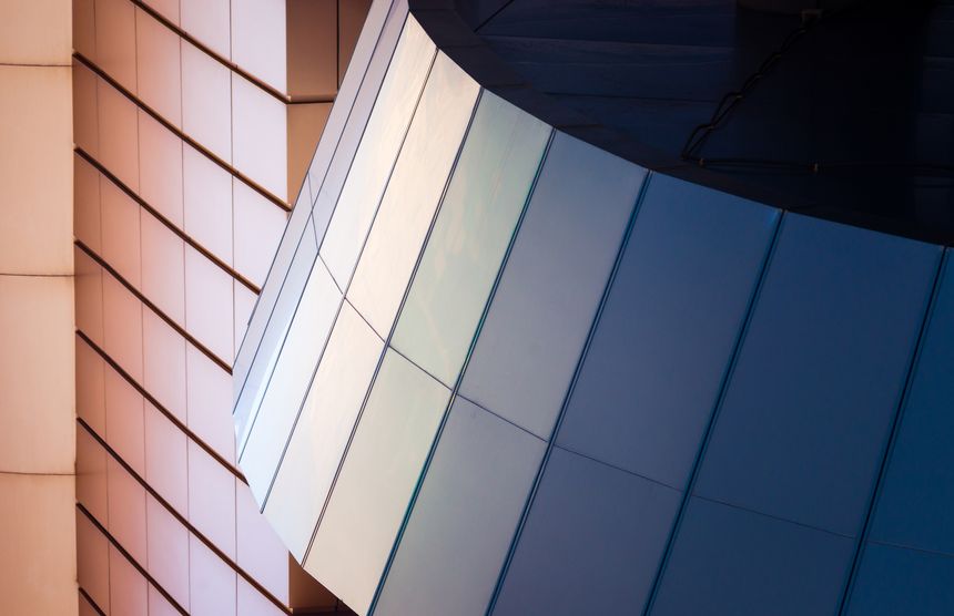 architectural abstract pattern fragment of a wall of blue modern building on a white background