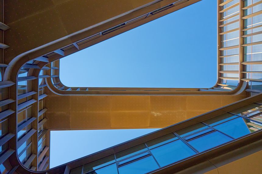 Geometric composition with architectural elements. Exterior of modern building against blue sky. Minimalistic street architecture in Copenhagen, Denmark
