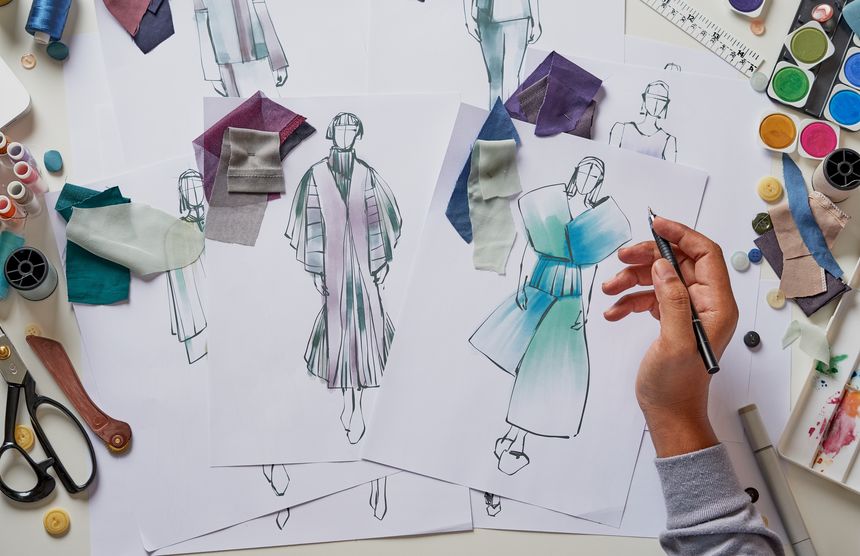 Fashion designer stylish drawings sketches textile fabric material Costume. Designer creative workshop studio.