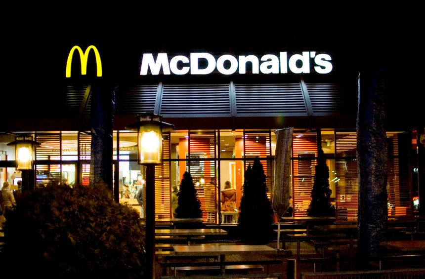 Poznan, Poland - December 2022: Mc Donald's restaurant logo at building.