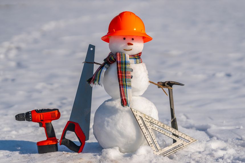 Snowman handyman holding saw and hammer. Snow man carpenter. Snowman builder for winter hardware store designs. Snowman worker with hardware. Snowman construction DIY in winter