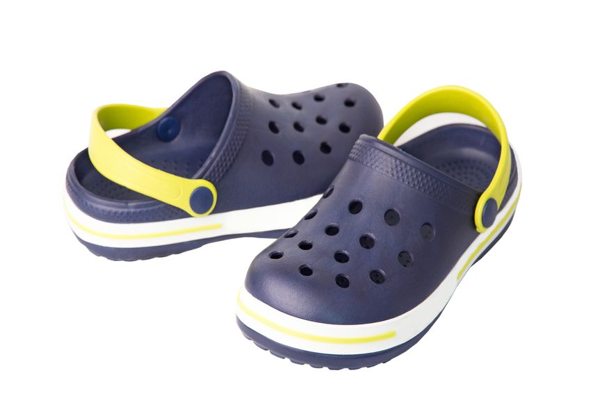 Blue crocs isolated on white background