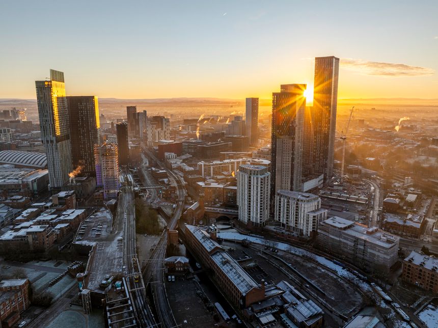 Aerial image of a beautiful sunrise over the frosty cityscape of Manchester