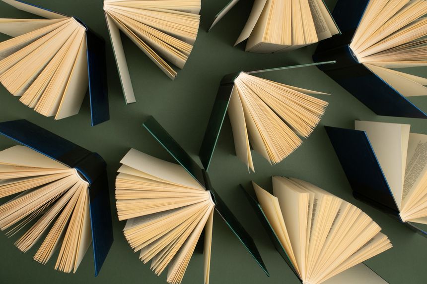 Creative pattern made of old books. Used hardback books. Education background. Top view.