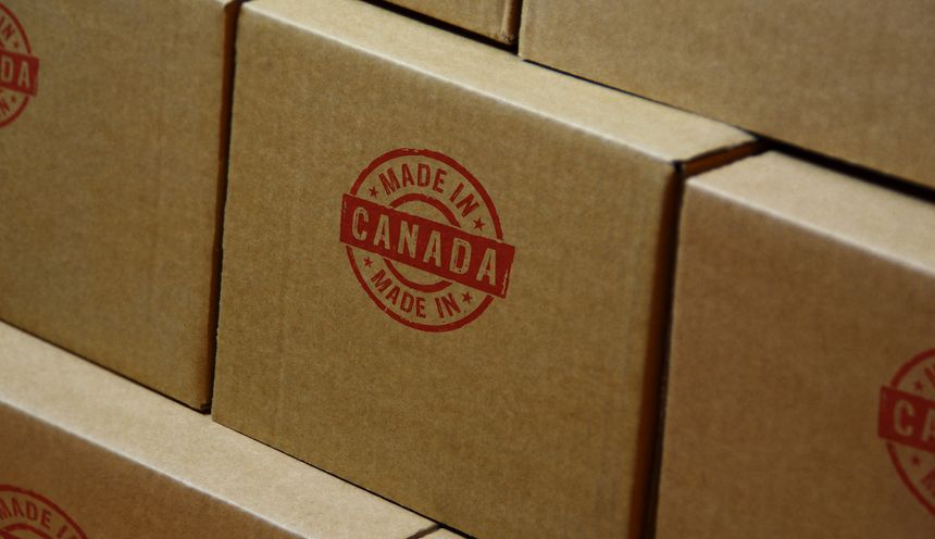 Made in Canada stamp printed on cardboard box. Factory, manufacturing and production country concept.