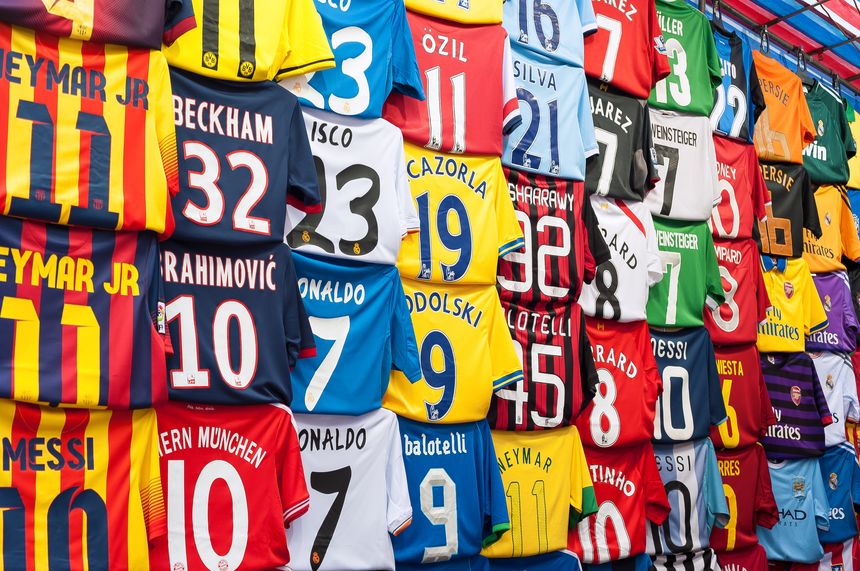 Mong Kok, Hong Kong - October 10, 2013 - Fake football shirts at a Mong Kok street market, Hong Kong. Mong Kok is home to several street markets and is Hong Kong's go-to place for cheap souvenirs.