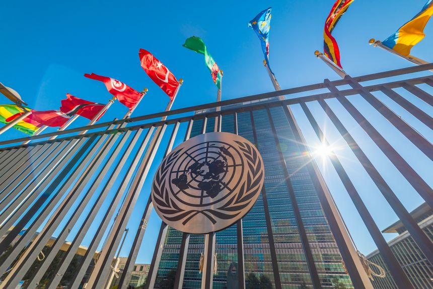 Onu building with flags under a blue sky in New York, USA