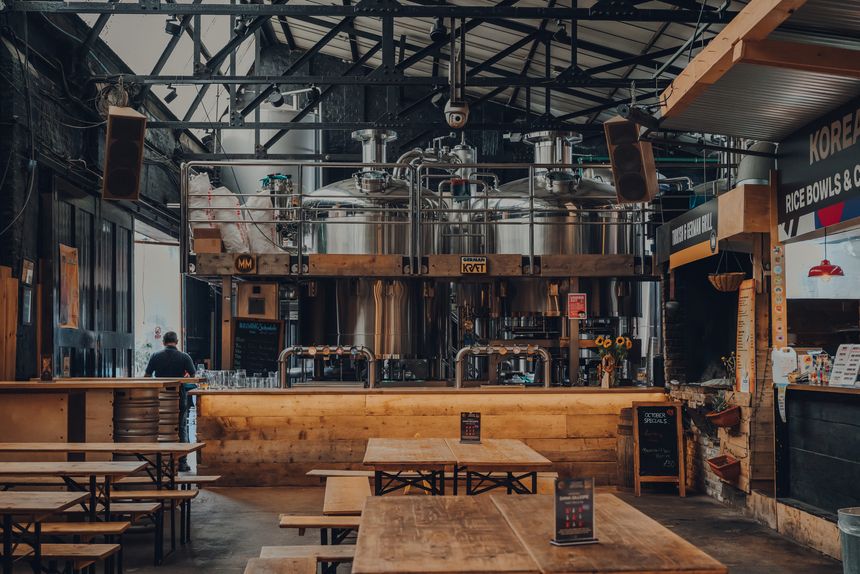 London, UK - October 17, 2021: German Kraft microbrewery and bar in Mercato Metropolitano, the first sustainable community market in London focused on revitalising the area and protecting environment.