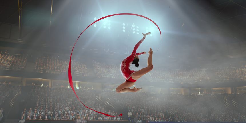 Woman rhythmic gymnast in professional arena.