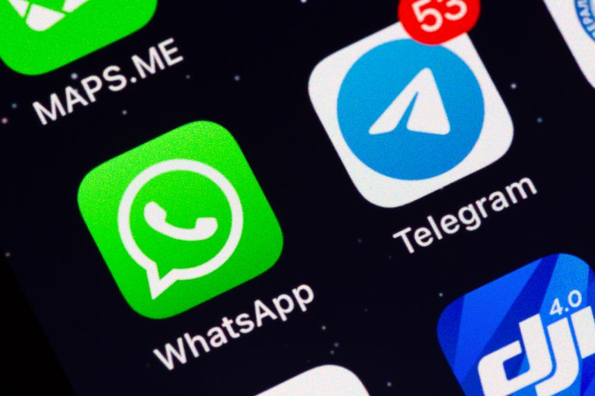 Moscow, Russia - December 13, 2024: Two most popular in the world messengers WhatsApp and Telegram app icons on display of an iPhone.