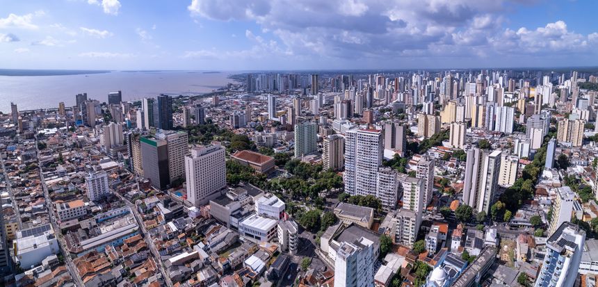 Beautiful aerial view of the city of Belém with the Amazon River in the background. Headquarters of the UN Climate Change Conference Cop30, Pará, Brazil. Concepts include environment, ecology, nature.