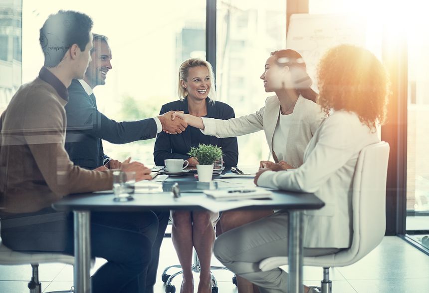 Cropped shot of businesspeople shaking hands during a meeting in an office