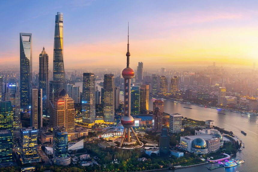 Aerial view of Shanghai city and Huangpu river at sunset, China.