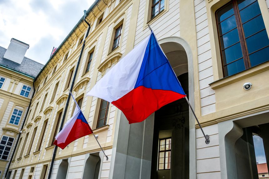 State flags of the Czech Republic on the facade of a government building in Prague. State and politics