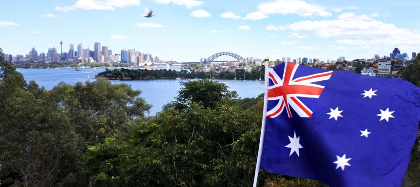The National flag of Australia flay along Sydney skyline, Australia
