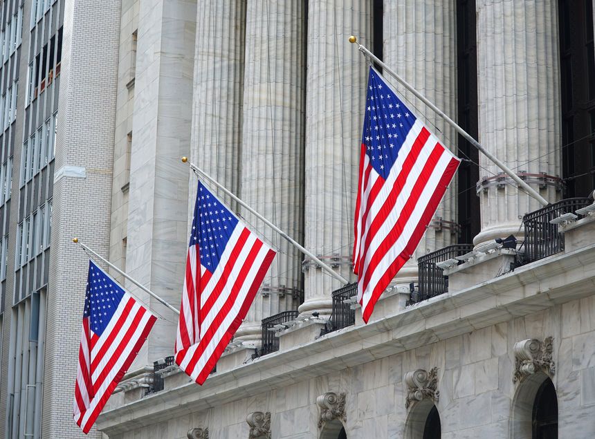 USA flag hanging in front of the New York Stock Exchange building