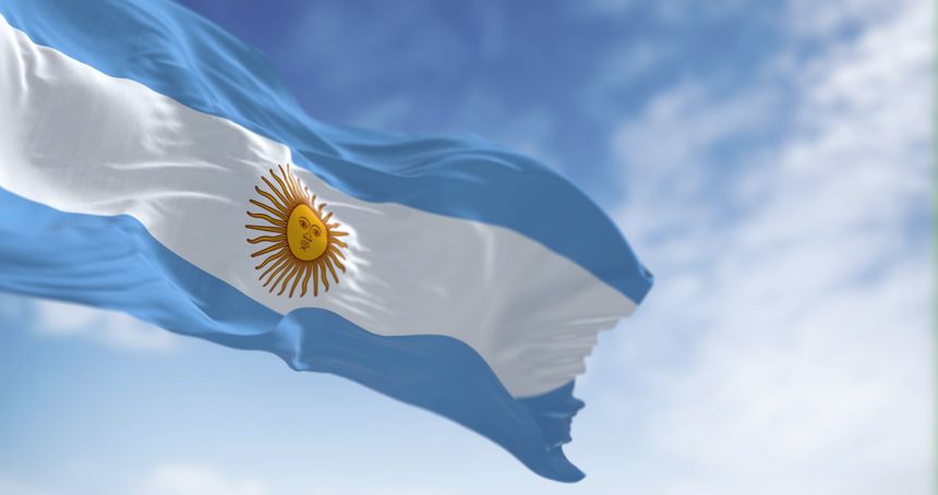 Argentina national flag fluttering in the wind on a sunny day. Three equal blue and white horizontal bands with the Sun of May in the center. 3d illustration render. Selective focus