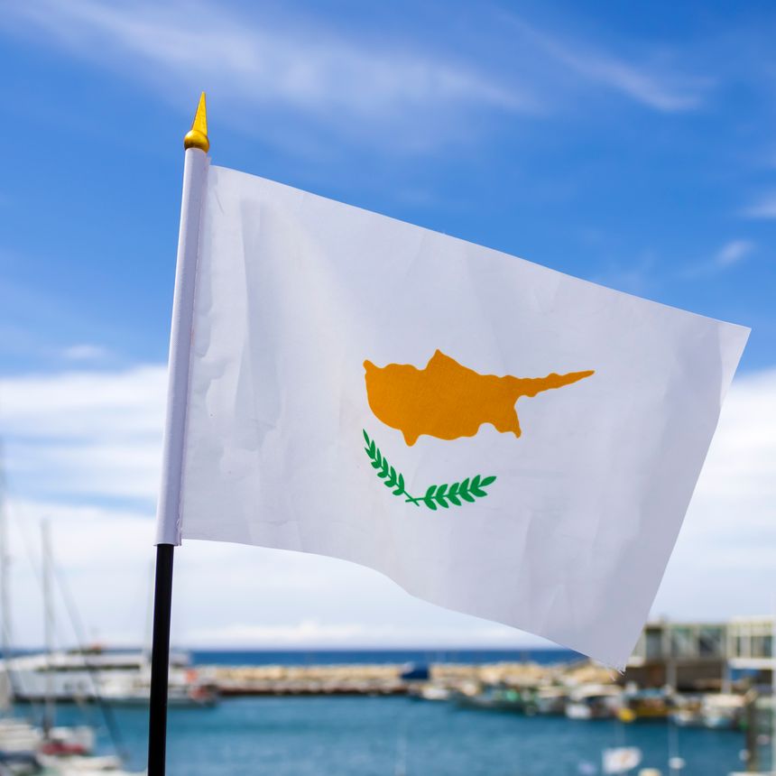 Flag of Cyprus in front of sea harbor