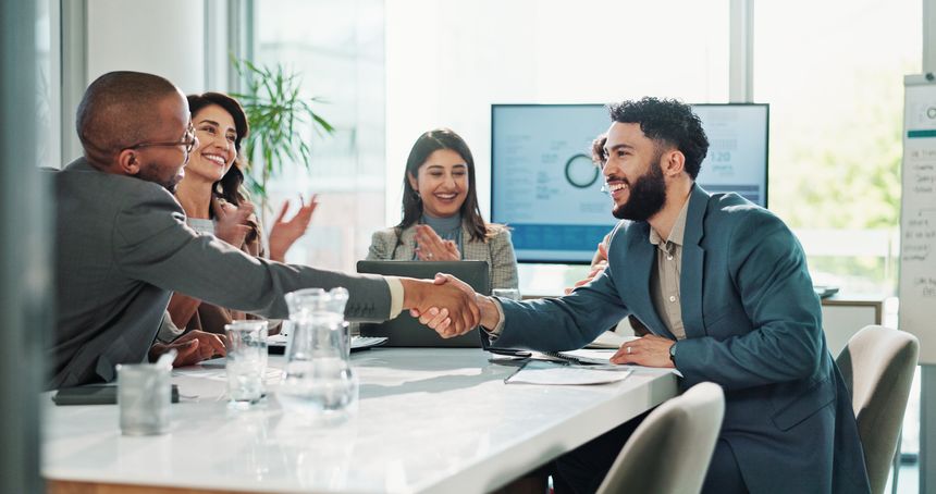 Businessmen, handshake or meeting with team applause for deal, agreement or success at office. Group, employees or colleagues shaking hands or clapping for business collaboration, winning or contract