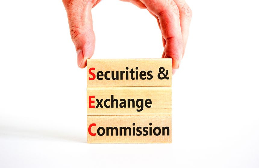 SEC securities and exchange commission symbol. Concept words SEC securities and exchange commission on wooden blocks on beautiful white background. Business SEC securities exchange commission concept.